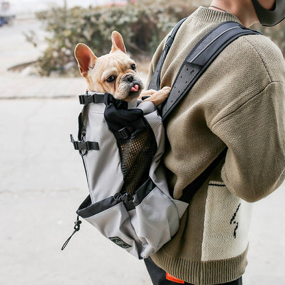 Active pet owner wearing a stylish and functional pet backpack, enjoying a comfortable and secure journey with their furry friend.