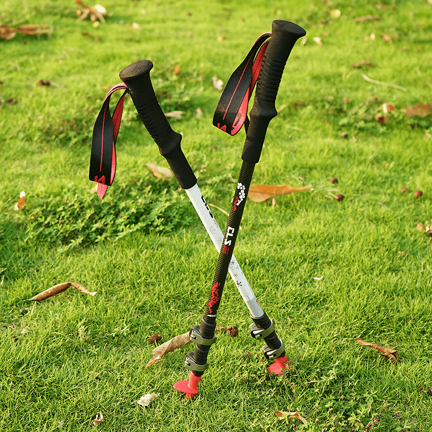 Durable and lightweight carbon fiber trekking poles with outer lock telescopic system, perfect for versatile outdoor adventures.