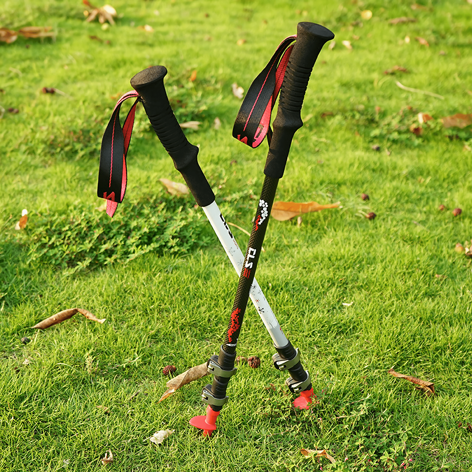 Durable and lightweight carbon fiber trekking poles with outer lock telescopic system, perfect for versatile outdoor adventures.