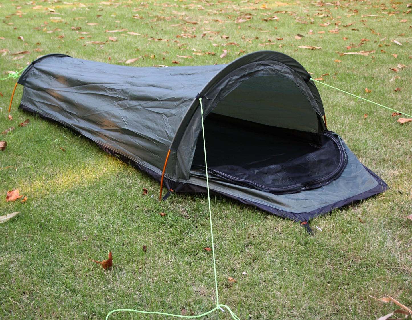 Extreme close-up of the tent's durable fabric in a gust of wind, showcasing its windproof and rainproof qualities.