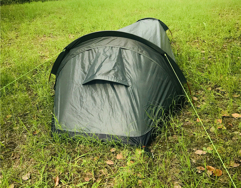 Durable tent in the midst of a rainstorm, highlighting its reliability and resilience in challenging weather conditions