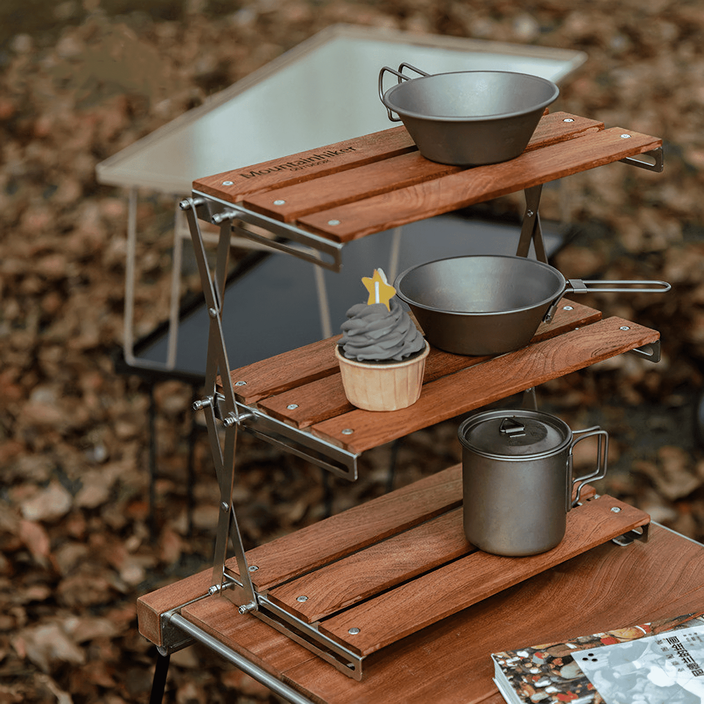 Foldable Three-Tier Camping Rack Table – Perfect for organized outdoor dining adventures.